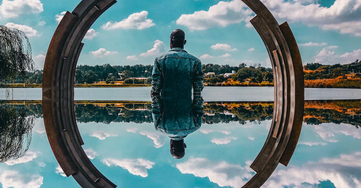 What are these double prices on voyages-sncf.com? - Man Standing Near Body of Water