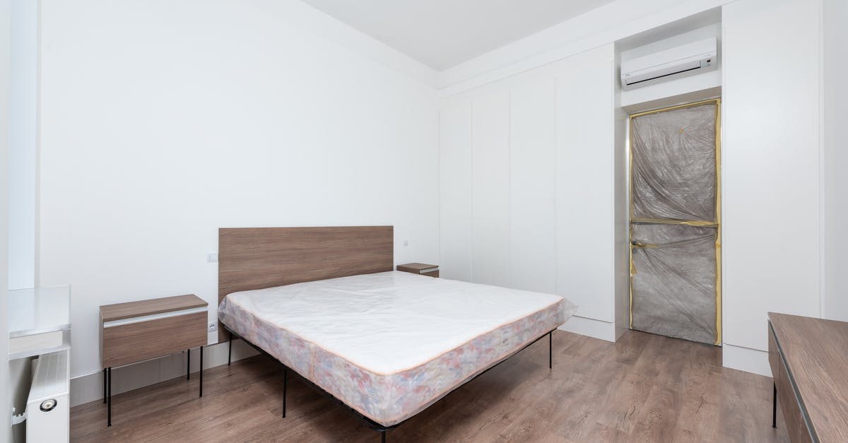 What are these white things in Stuttgart - White Bed Linen on Brown Wooden Bed Frame