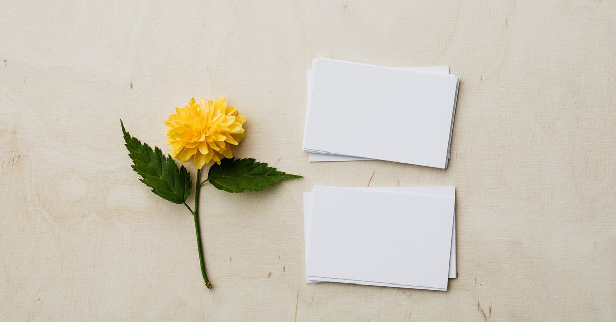 What can I do if I lose my Yellow Card? - Blank mockup business cards and yellow flower on desk