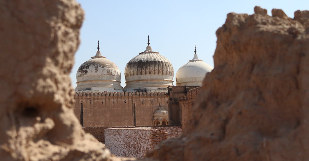 What can I send as Travel History in Canada Visa? - Domes of ancient Abbasi Mosque located in arid desert on territory of Derawar Fort in Pakistan