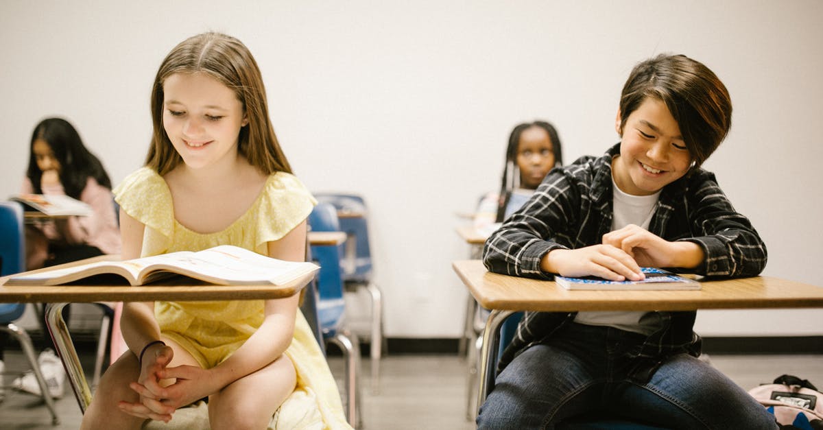 What can Thomas Cook customers (who have not yet departed) do now they have stopped operating? - Two Students Smiling While Sitting on Their Desk