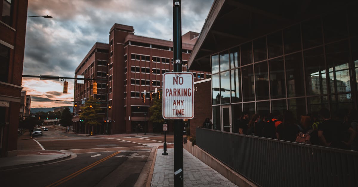 What do these warning/restriction codes in air tickets mean? - Signboard with NO PARKING inscription near city road