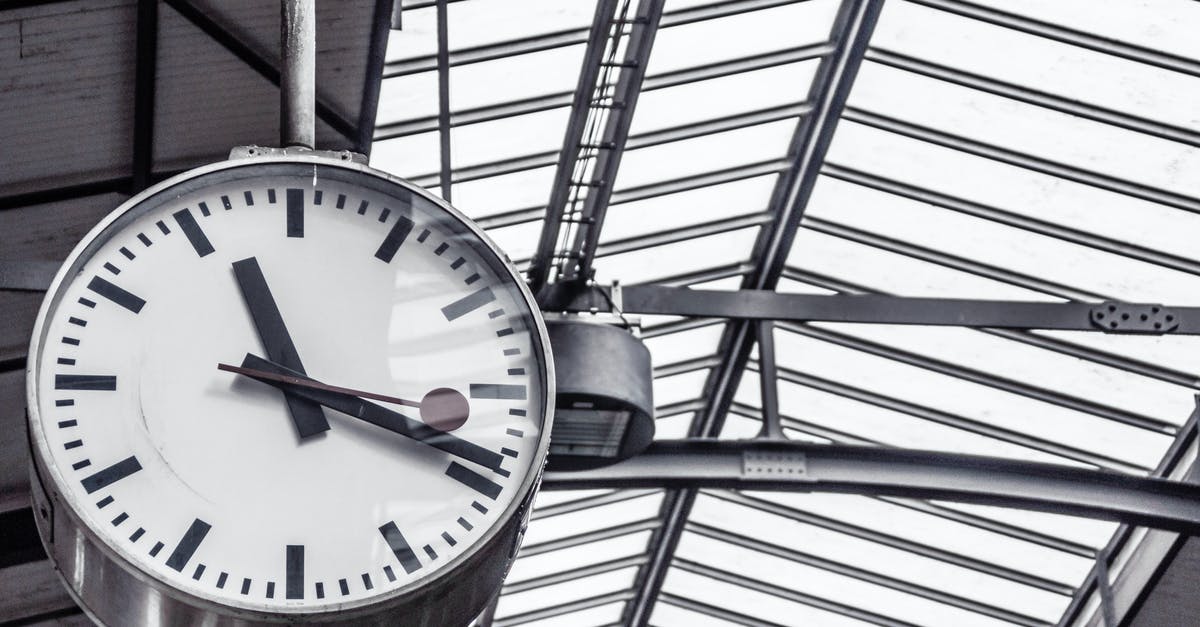 What does '48 hours before departure' mean? - Train Station Clock Displaying 11:19