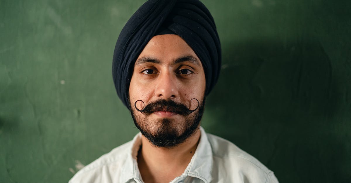 What does a Sri Lankan visa for Indians look like? - Positive man in traditional turban with mustache