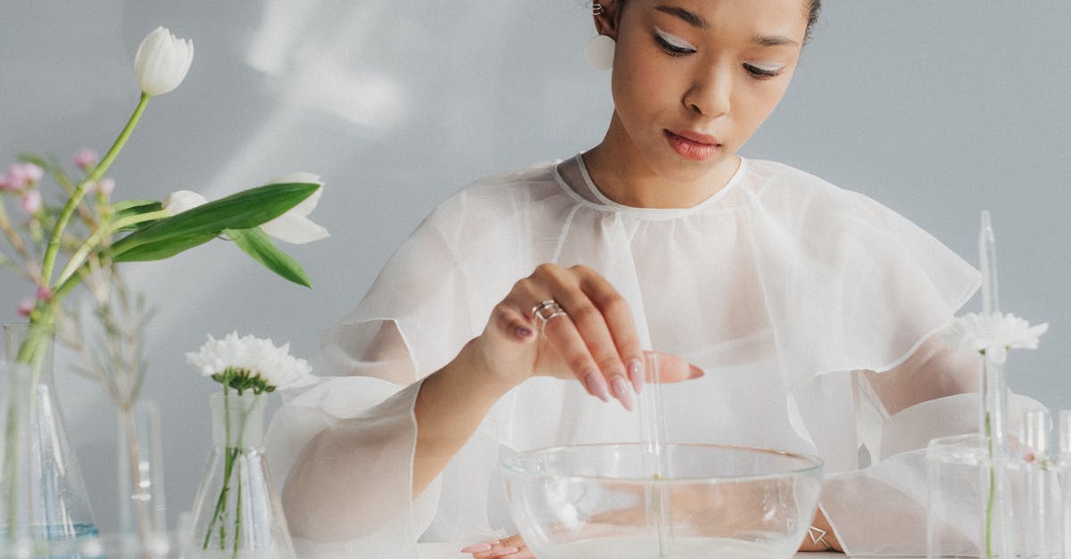 What does a Tajik GBAO permit look like? - Woman in White Making Table Arrangement Looking Like Science Laboratory