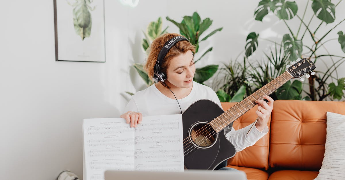 What does First class (fare class F) on Jetstar Airways mean? - Happy Woman Playing Guitar Having Online Class