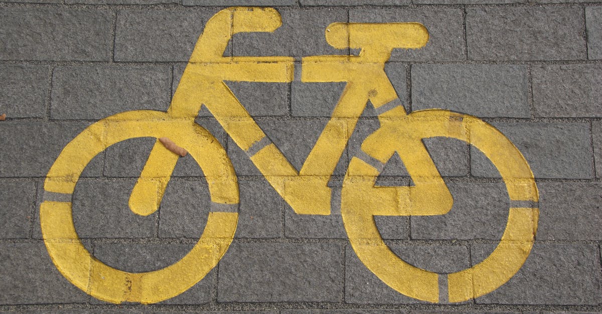 What does the Apple Command key symbol (⌘) mean on Icelandic road signs? - Bicycle Lane on Gray Concrete Road