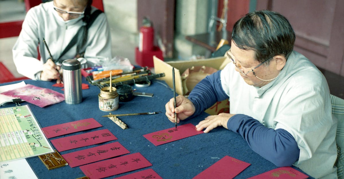 What does this Chinese character 天 mean on my visa? - Elderly Woman Writing on Red Envelope