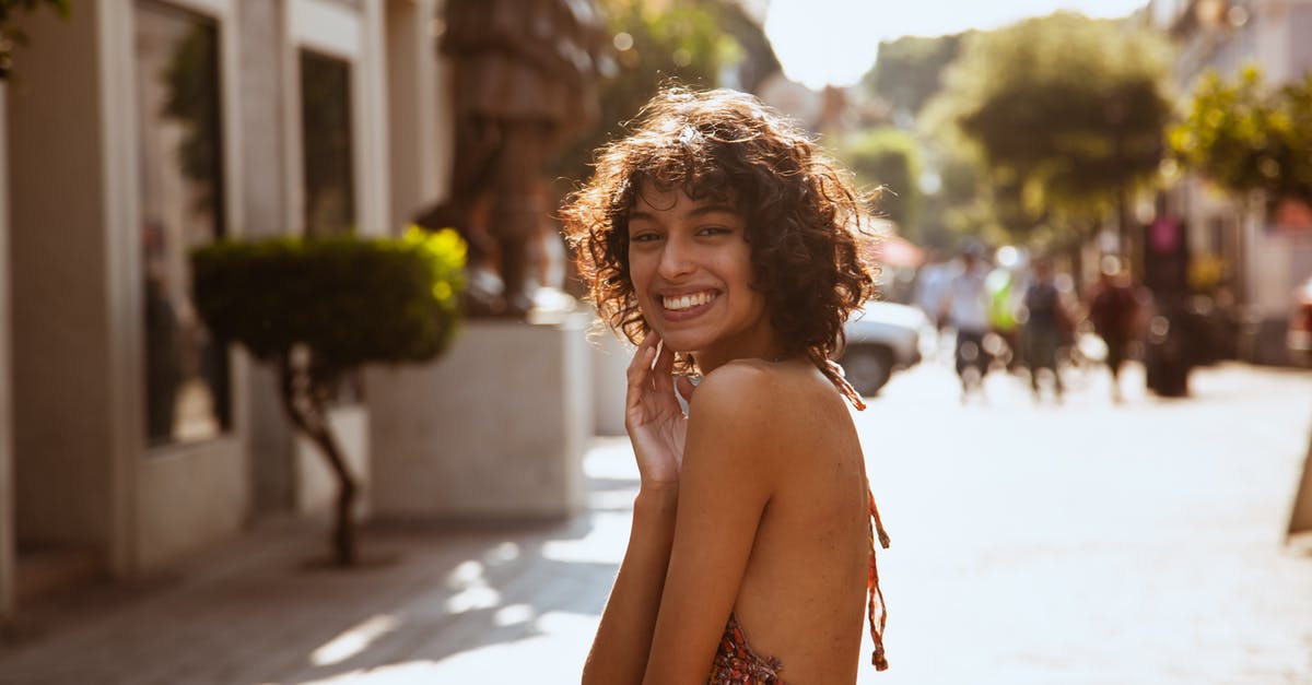 What exactly is a "FM-T", Mexico Tourist Card? - A Woman Smiling with Curly Hair