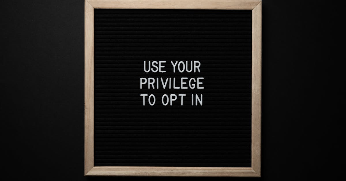 What exactly is a "No Objection Certificate" (NOC)? - From above composition of contrast blackboard in wooden frame with white USE YOUR PRIVILEGE TO OPT IN title on black background