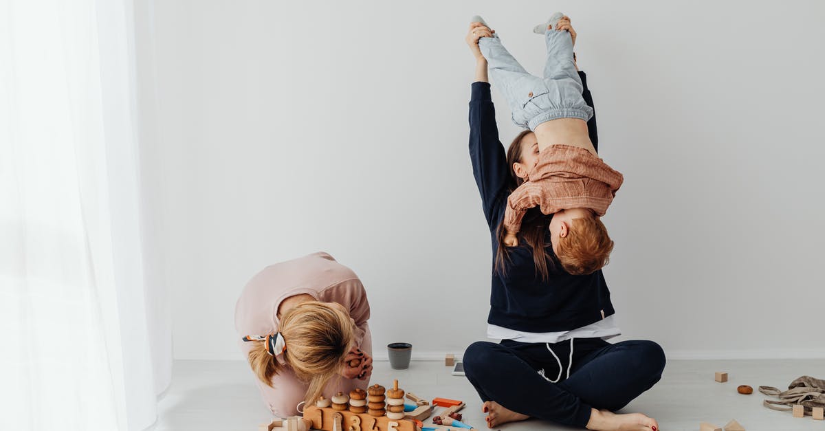 What happened to lifting the liquids ban? - Woman in Blue Denim Jacket and Black Pants Sitting on Floor