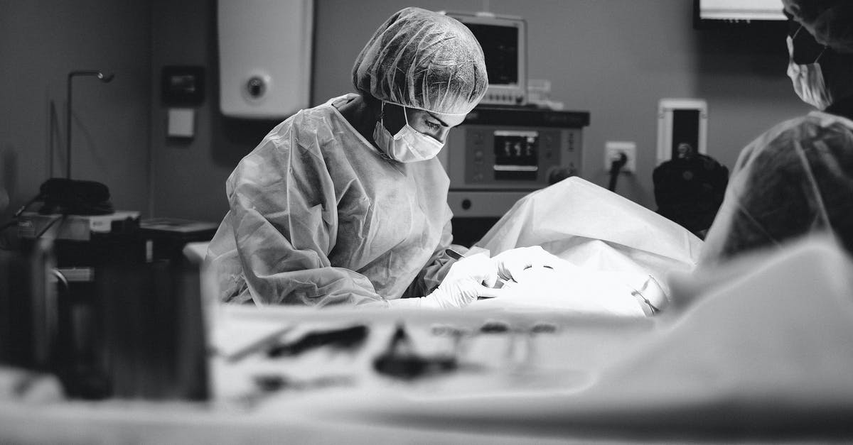 What happens if a tourist needs a medical surgery in U.S.? - Person in White Robe Sitting on Bed