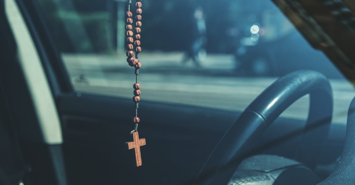 What happens if RFID system in my "biometric" travel passport malfunctions when I cross the border? - Brown Rosary Dangling on Car's Rear View Mirror