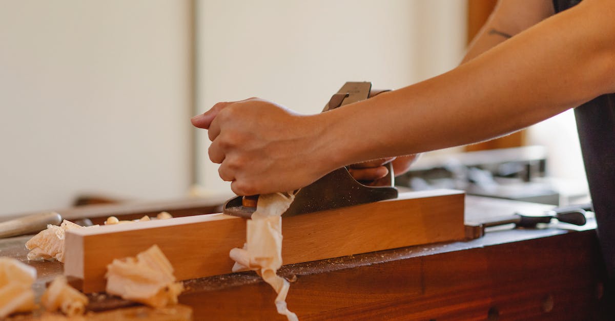 What happens if someone dies on board a plane? - Crop woodworker planing hardwood plank