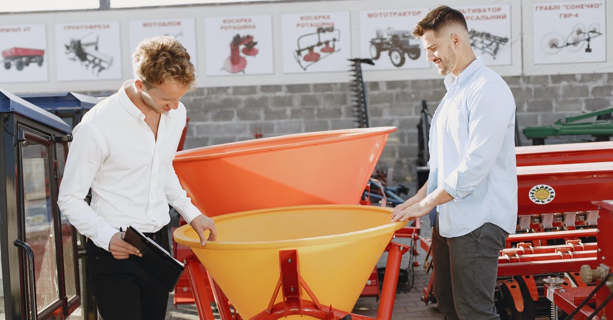 What happens if you declare an item and it is confiscated? - Man in White Dress Shirt and Black Pants Holding Red Plastic Container