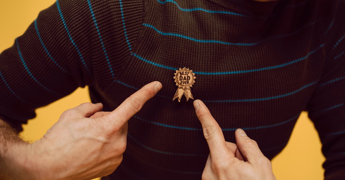 What happens to reward points/miles when you are rebooked? - A Man Pointing a Best Dad Ever Pin