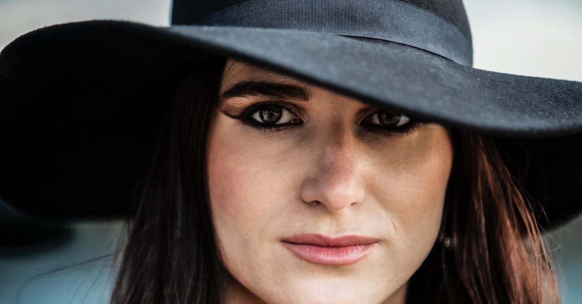 What If my Russian visa got refused? [closed] - A Close-up Shot of a Woman Wearing a Black Hat