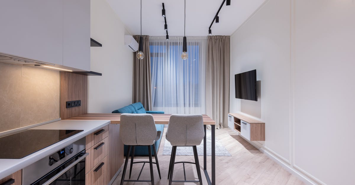 What immunizations are recommended or necessary for Cambodia? - Interior design of modern spacious apartment with necessary furniture and appliances with TV set and air conditioner