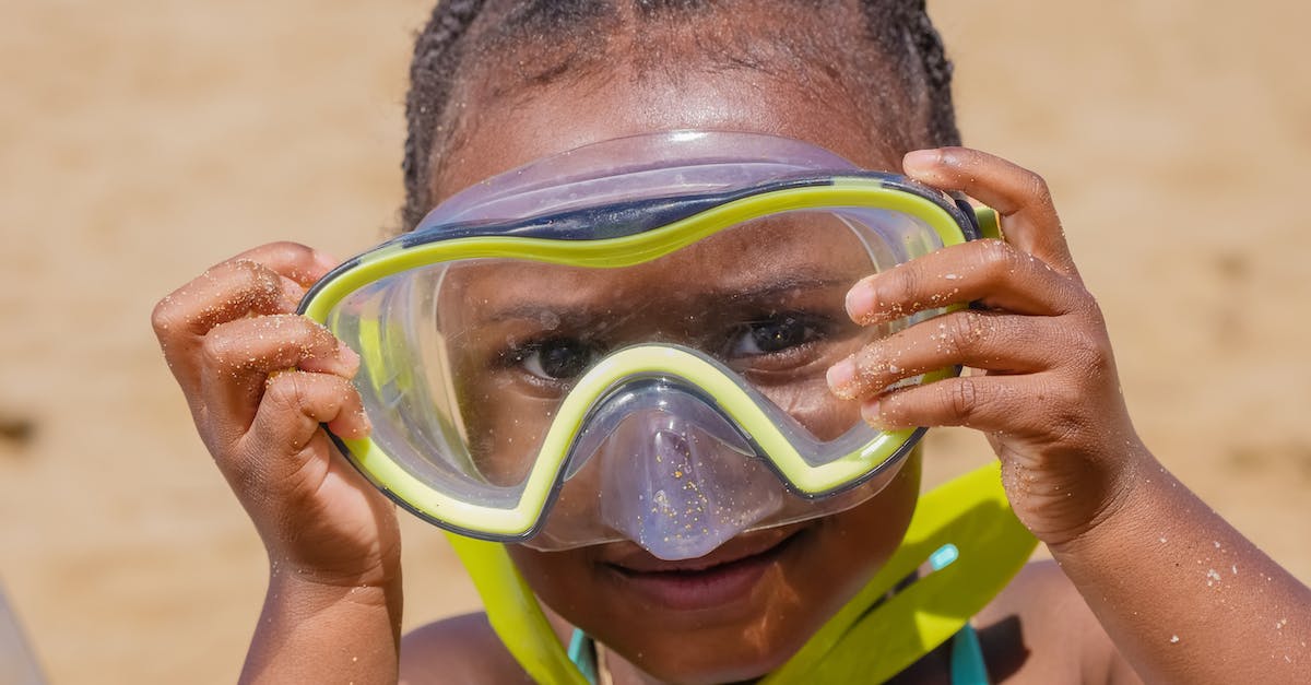 What is a good place in Goa to stay with a beach and scuba diving? [closed] - Boy in Green and Blue Goggles