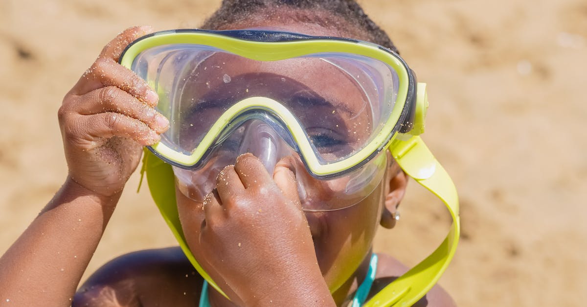 What is a good place in Goa to stay with a beach and scuba diving? [closed] - Woman in Green and Blue Swimming Goggles and Swimming Goggles