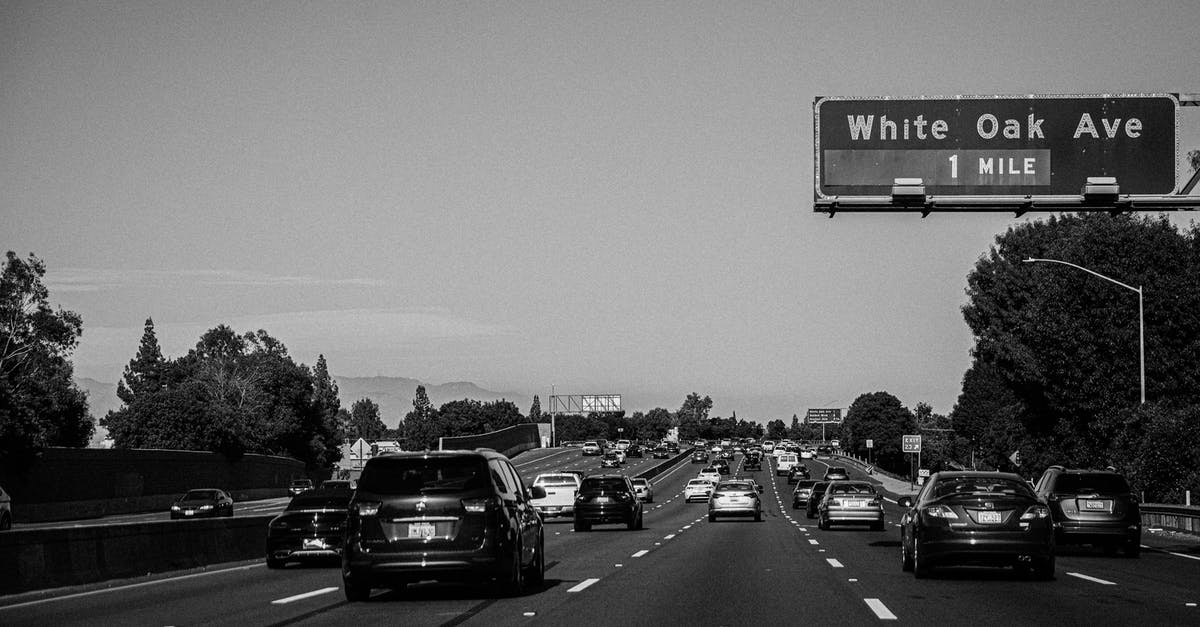 What is a "penalty for a driving offence?" - Grayscale Photo of Cars on Road