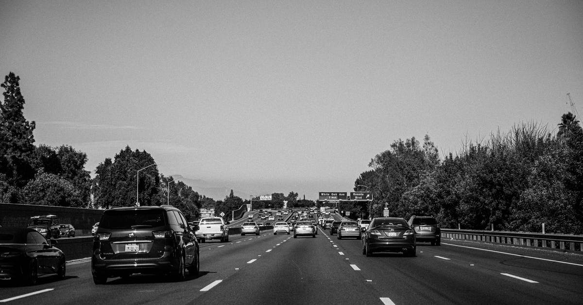 What is a "penalty for a driving offence?" - Grayscale Photo of Cars on Road