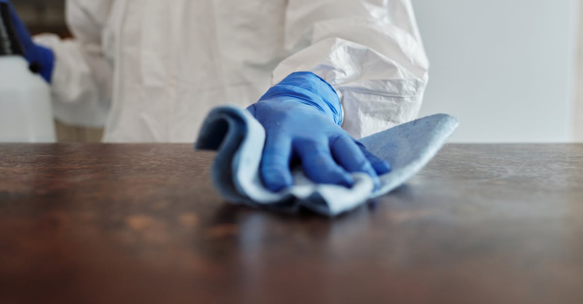 What is a typical room cleaning tip in Montreal? - Close-Up Photo Of Person Cleaning The Table