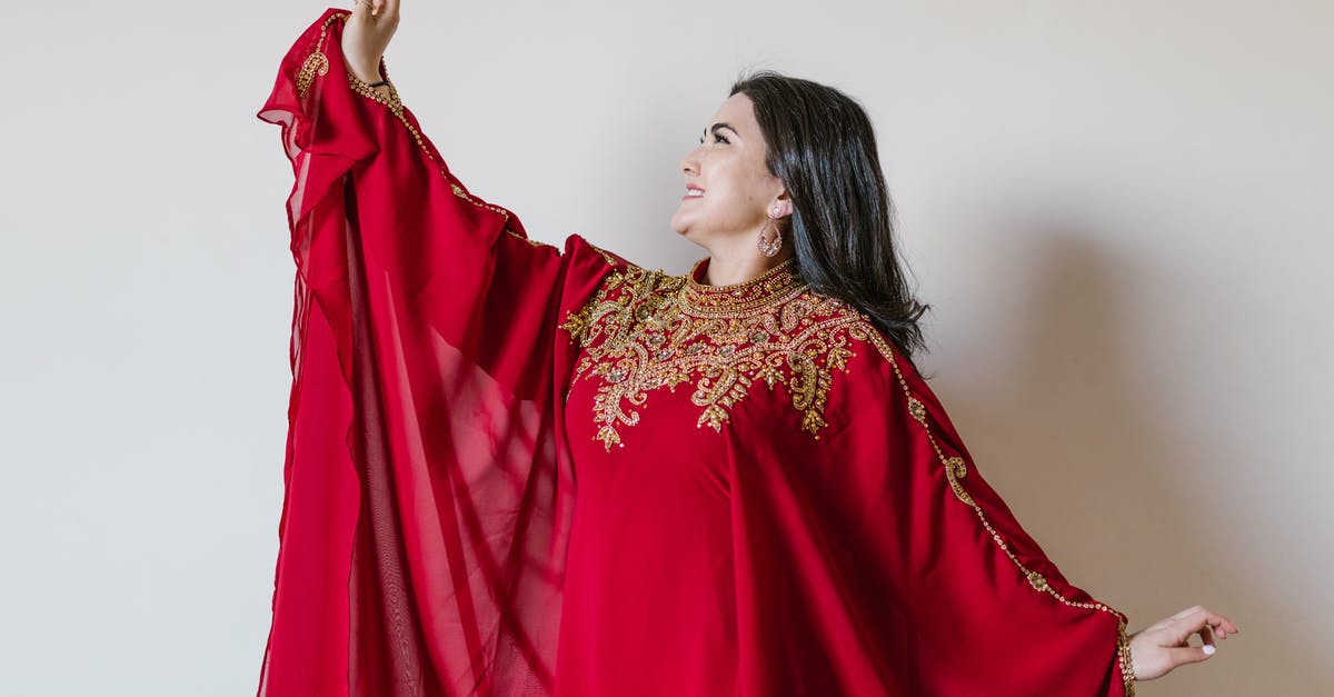 What is appropriate attire for women in Muslim countries? - Woman in Red and Gold Sari