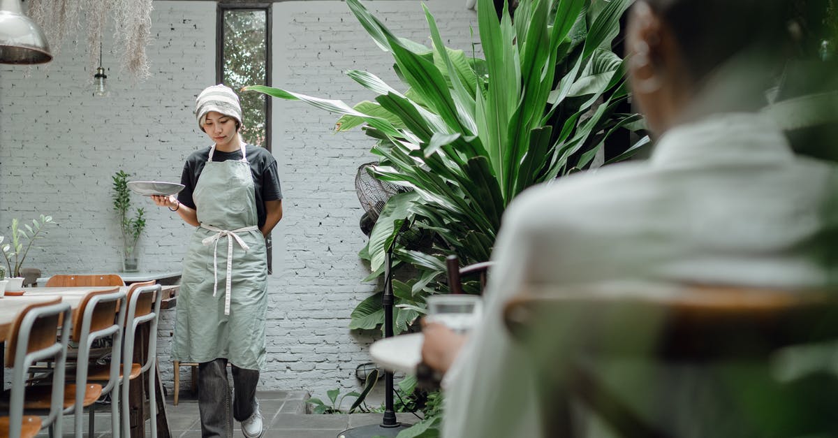 What is included in the VFS $75 walk in service? - Calm waitress carrying plate with guest order