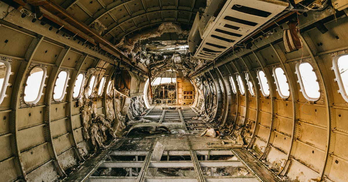 What is more effective seeking luggage damage compensation from the aiport or airline? - Interior of crashed aircraft cabin with windows