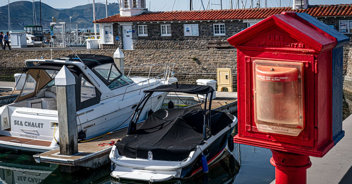 What is my port of entry into India? - Blue and White Boat on Dock