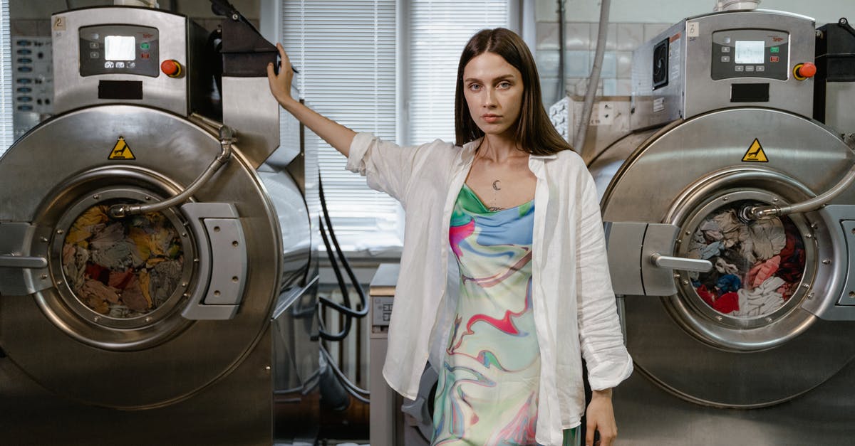 What is the difference between taxi, private hire, and chauffeur services? - Woman Standing Between Washing Machine