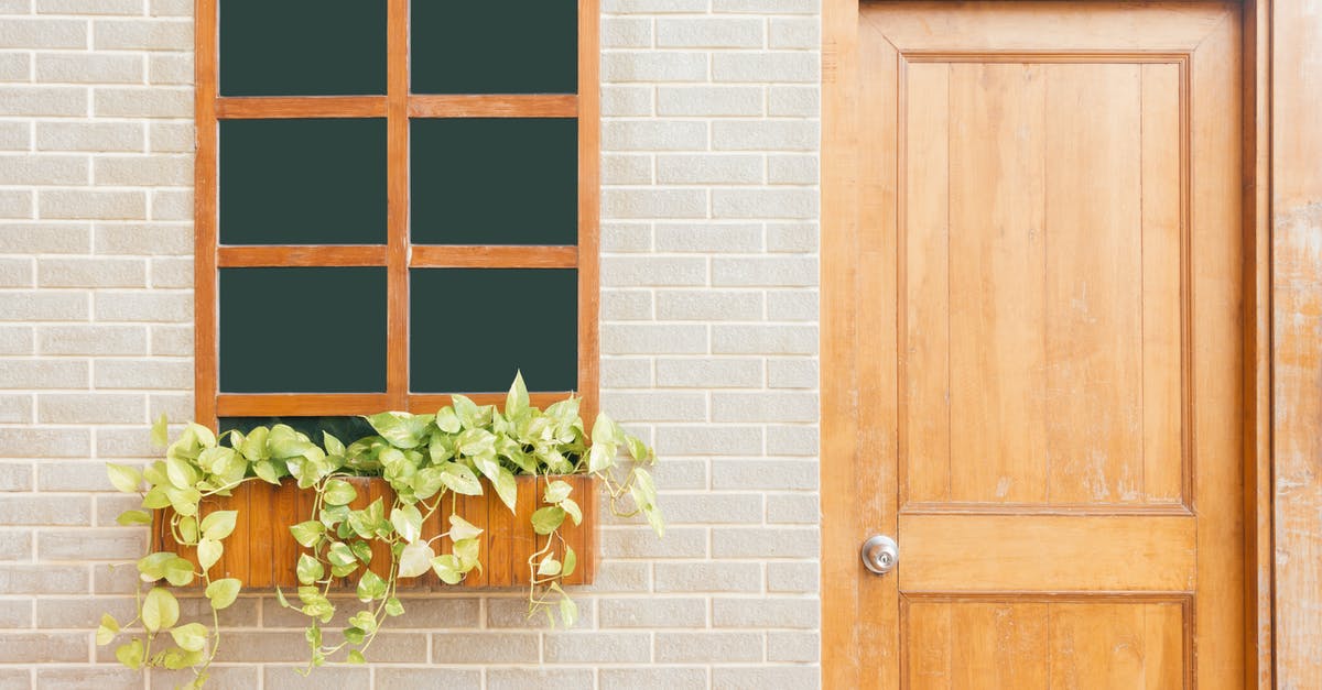 What is the first entrance to the airport called? [closed] - Photo of Wooden Door Near Window