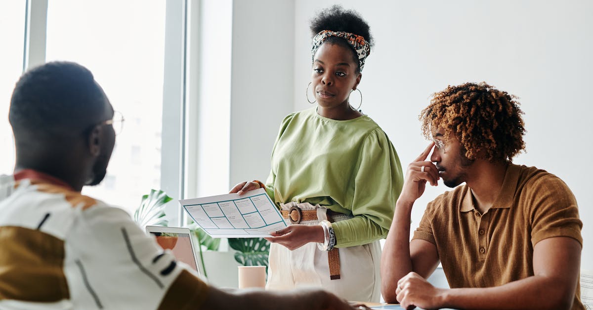 What is the protocol for taking a last minute cruise? - Woman Having a Meeting with Men at the Office