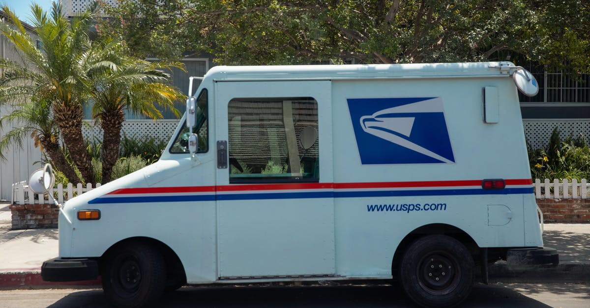 What is this arch-and-tower near a road? - White Delivery Van Parked Near Green Tree