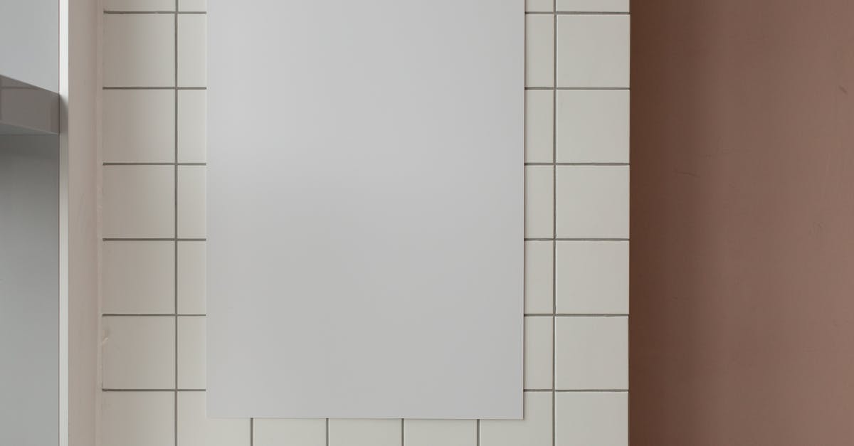 What is this distinct ceramics style and where it is made? - Empty paper on tiled wall