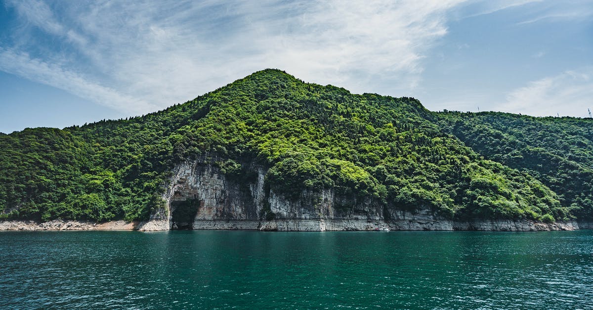What is this island in the South China Sea called? - Landscape Photo of Mountain Covered With Trees