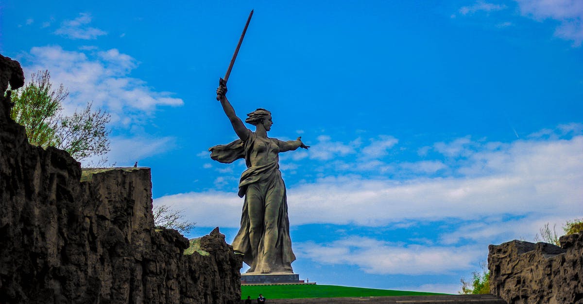 What is this monument in Tallinn called? - Lady of Justice Statue Under Blue Sky