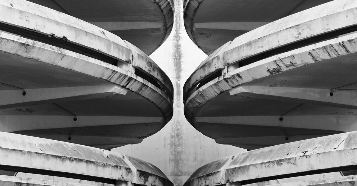 What is this strange almost symmetrical location in Nevada? - Grayscale Photo of Tunnel With Tunnel