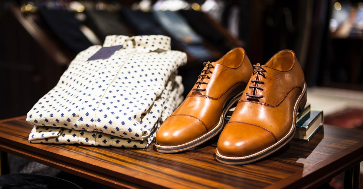 What kind of clothes and footwear are ideal to visit Egypt? - Pair of Brown Leather Casual Shoes on Table