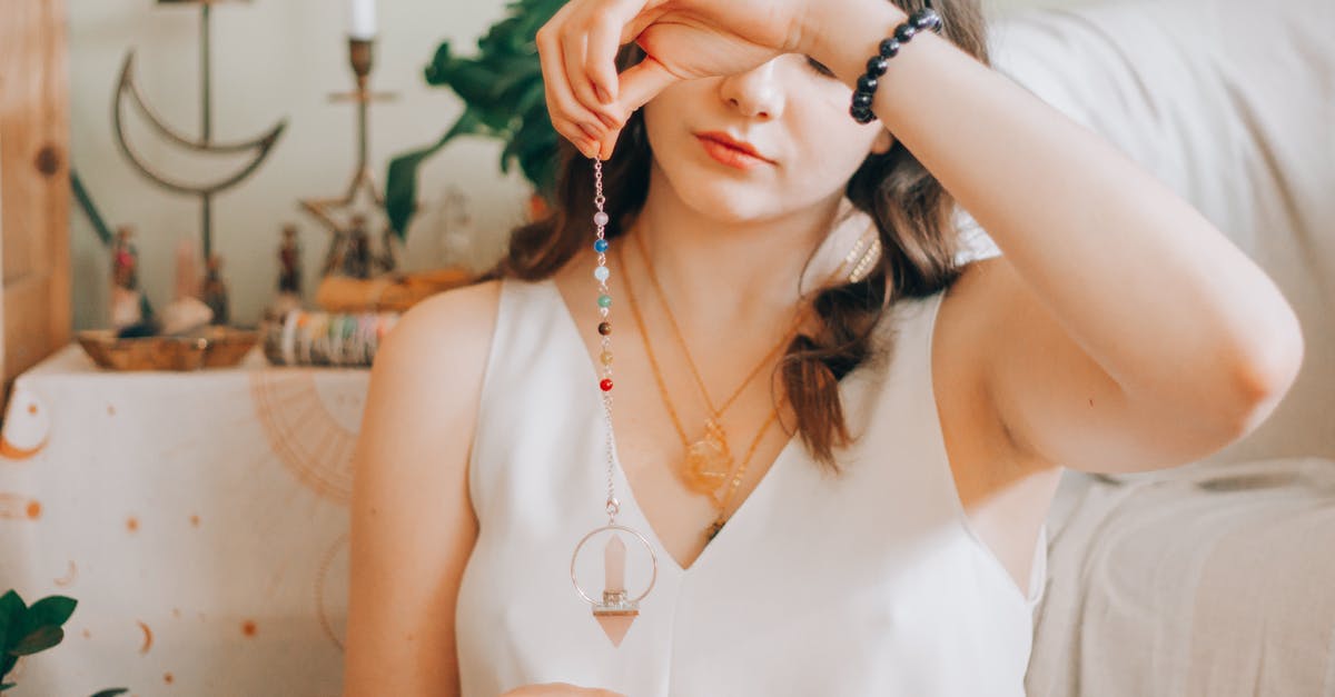 What kind of proof of residency is accepted by Disneyland? - Woman telling fortune with silver pendant