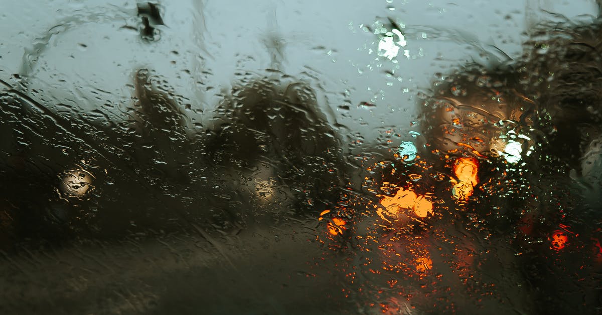 What kind of weather to expect in Budapest in late March/early April? - Road in modern city street with lights through car window in rainy weather