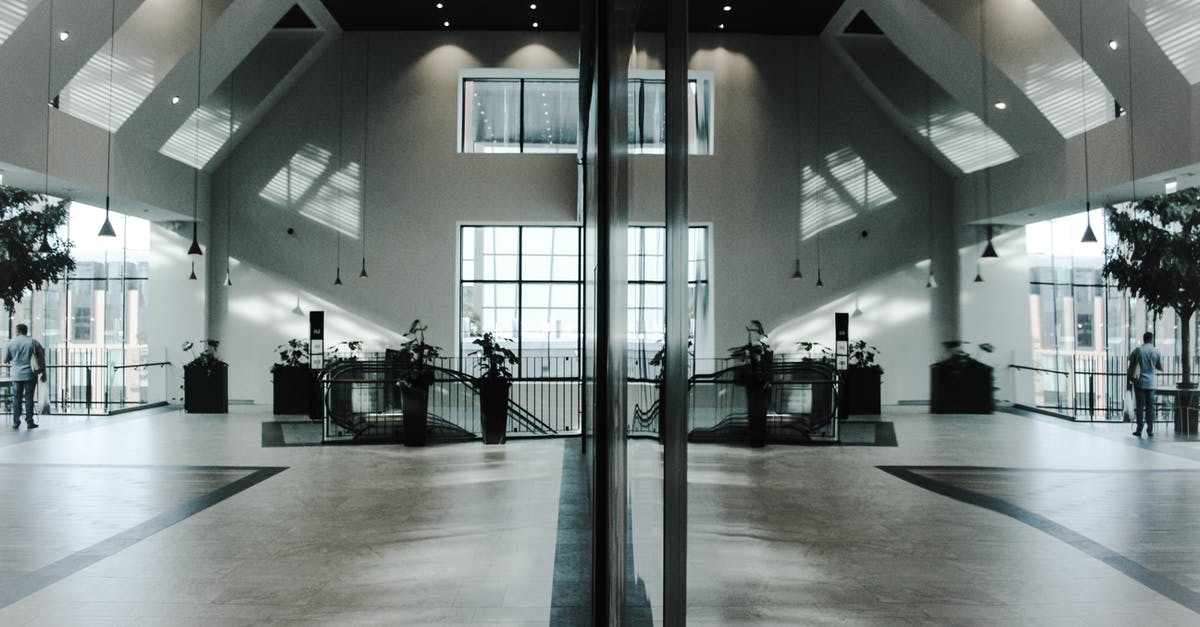 What lounge and shower options are there at Dubai Airport? - Empty Room Near Brown Black Staircase