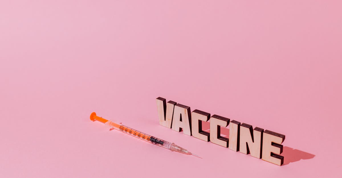 What makes vaccinations "recommended"? (for Philippines) - A Syringe and Vaccine Lettering Text on Pink Background