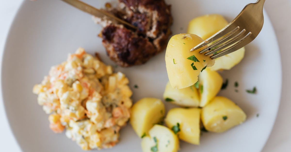 What meals are available on Russian trains? - Plate with boiled potatoes Russian salad and meat cutlet