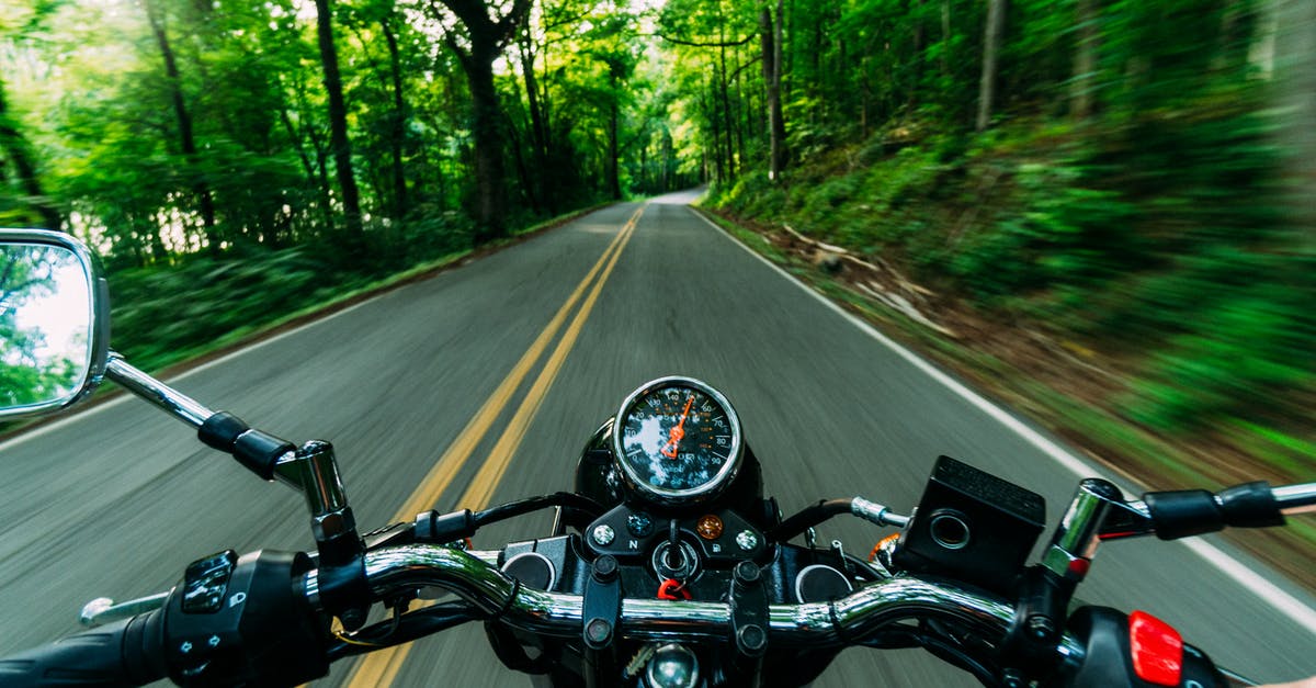 What measures can one take to keep a motorcycle safe during a road trip? - Motor Bike Running Close-up Photography