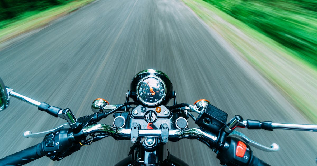 What measures can one take to keep a motorcycle safe during a road trip? - Black Motorcycle on Road