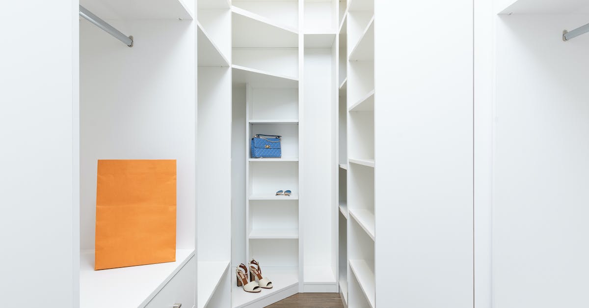 What meteorological conditions do I need to consider when travelling to a new place? - Perspective of white dressing room with rows of shelves and metal railings in modern design