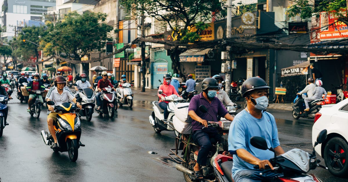 What motorbike to use in Vietnam - People Riding Motorcycle on Road