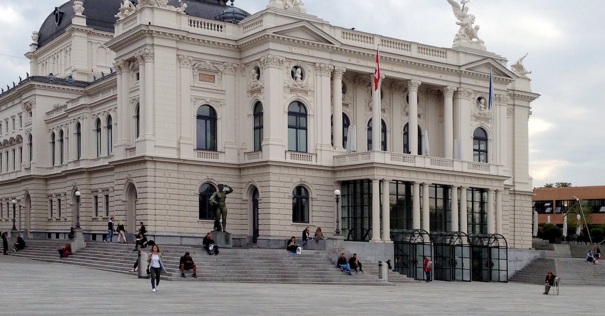 What one-day trips are available from Zurich (Switzerland)? - People Walking Beside White Concrete Structure